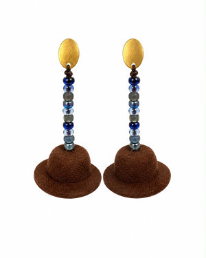 Pair of earrings with brown felt hats and beaded stems on a white background