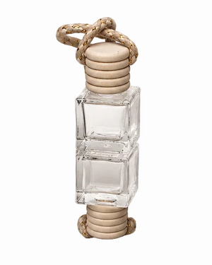 Clear glass bottle with wooden cap and rope on a white background