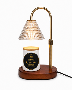 Decorative candle with wooden base and brass lamp on a white background