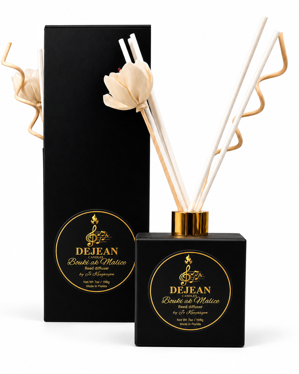 Black diffuser bottle with gold accents and white reeds next to a black box with gold text on a white background.