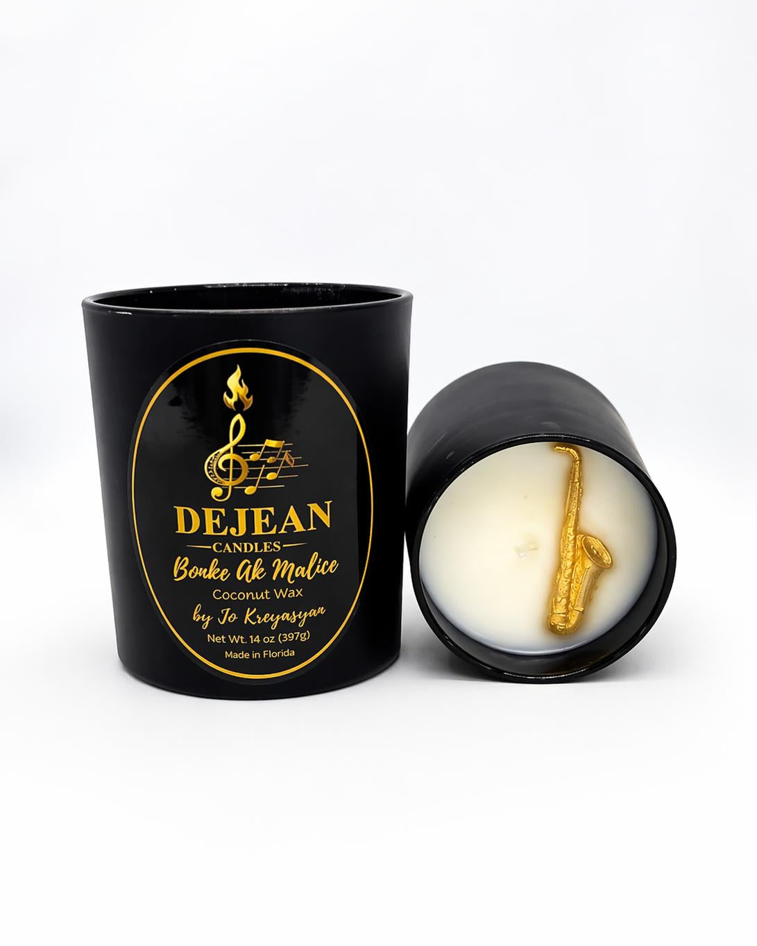 Black candle jar with gold design and 'Dejean Candles' branding on a white background