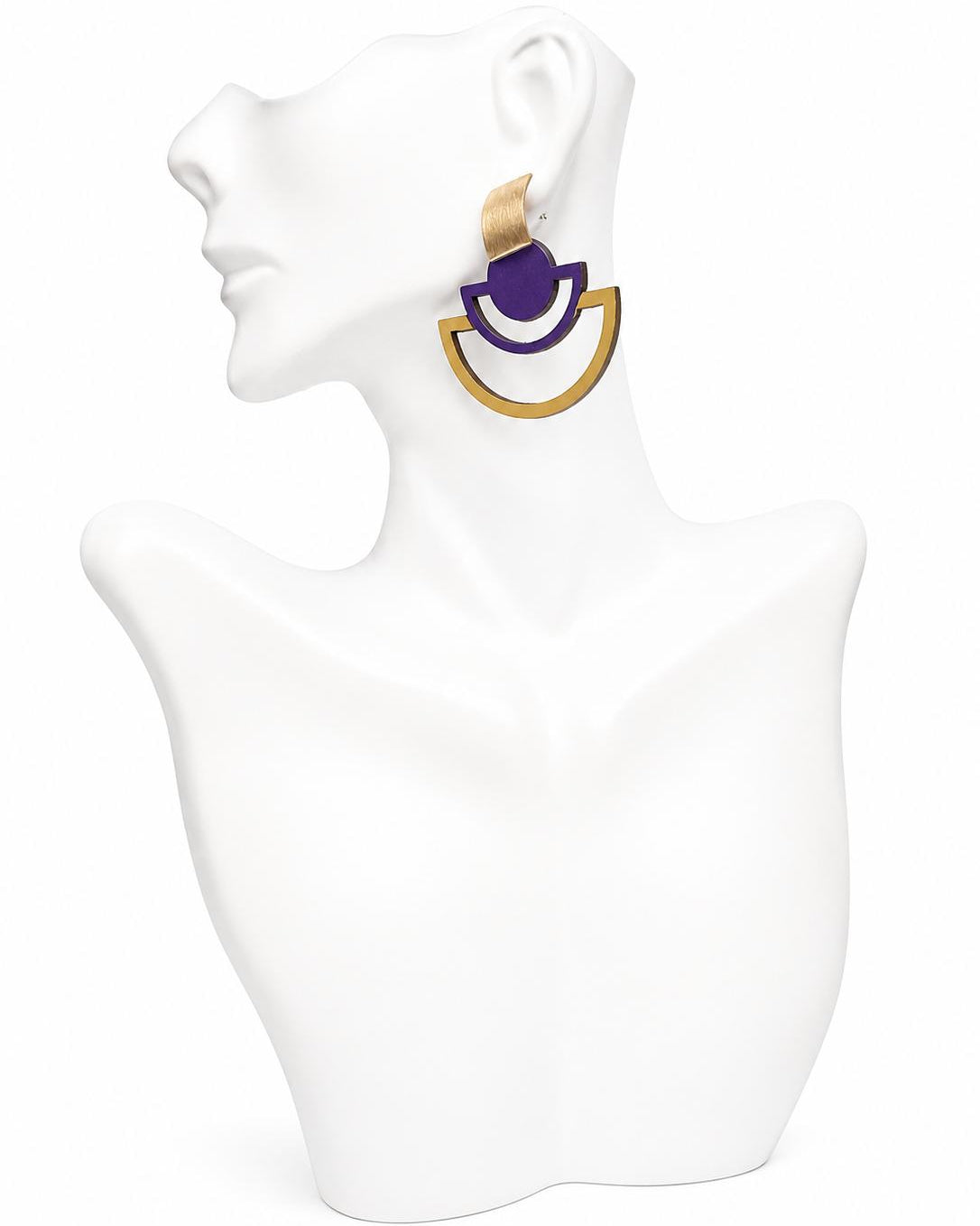 Earring displayed on a white mannequin bust with a plain background