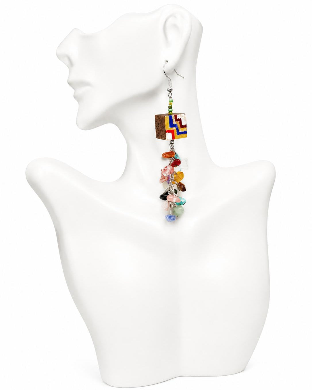 Colorful beaded earring on a white mannequin bust