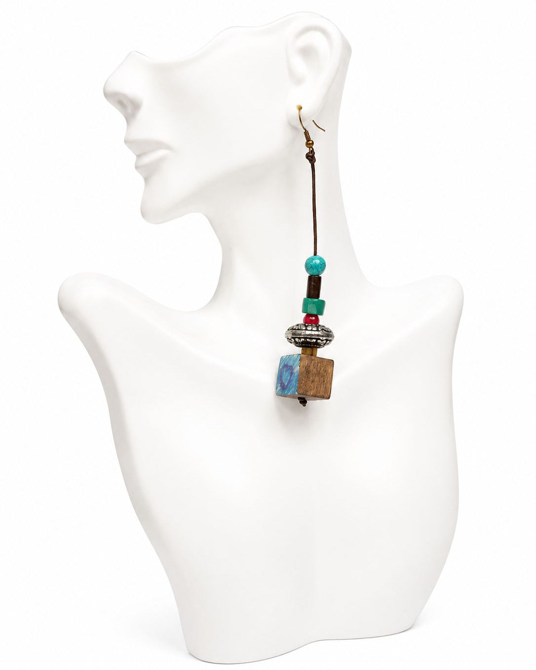Earring with colorful beads on a mannequin bust against a white background