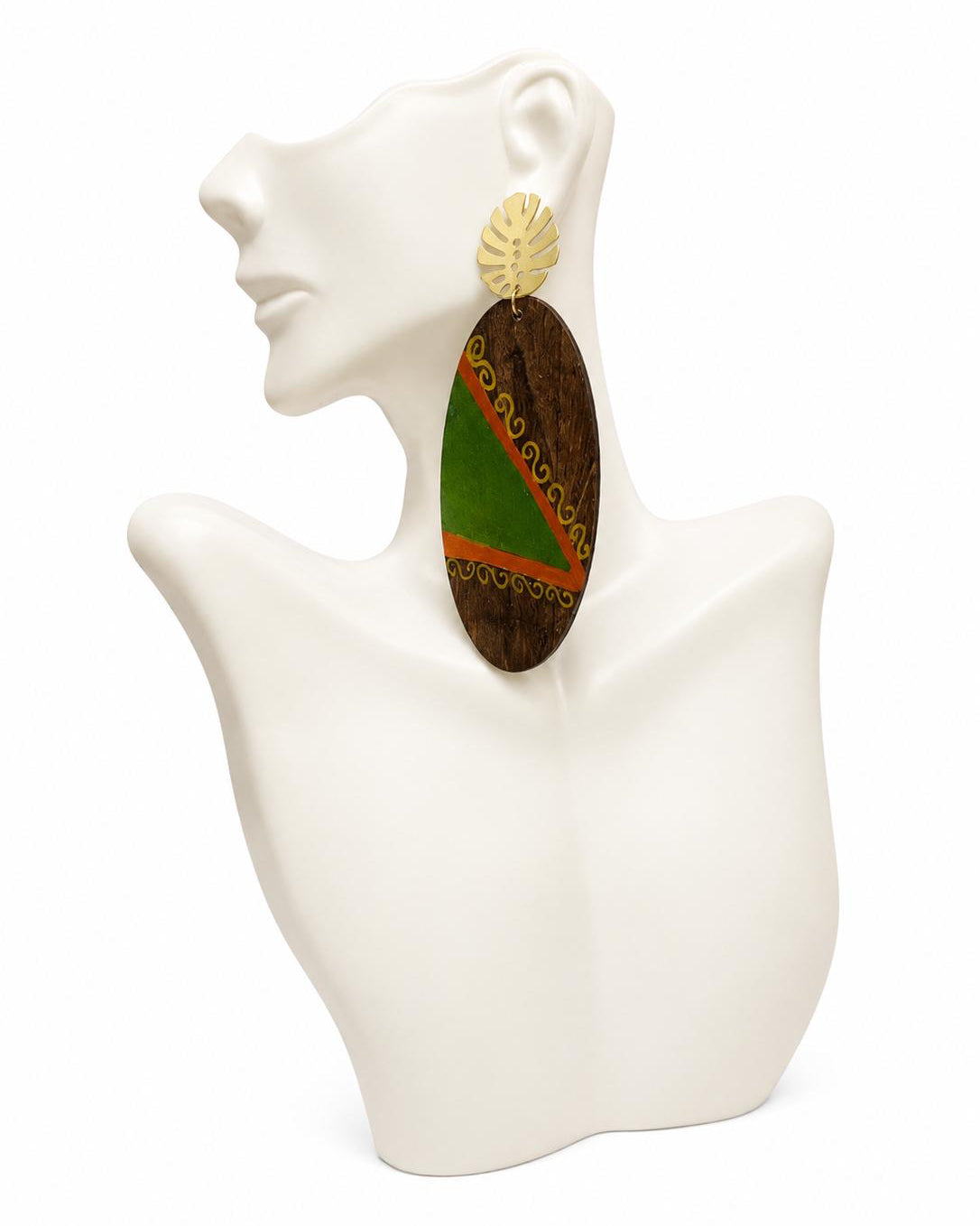 Earring on a mannequin display with a colorful design