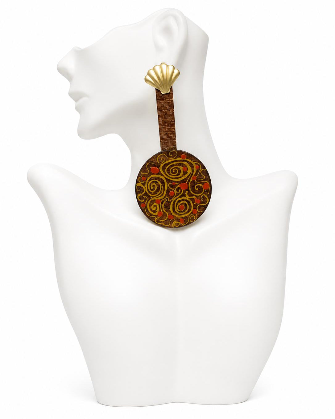 Decorative earring with spiral design on a mannequin bust