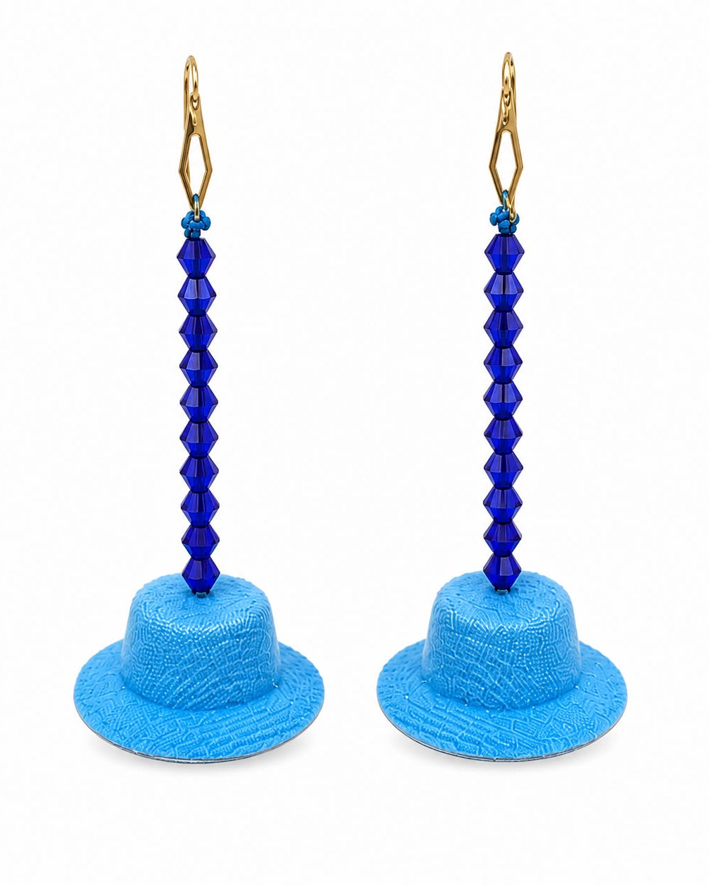 Blue bucket hat earrings with blue beaded stems on a white background