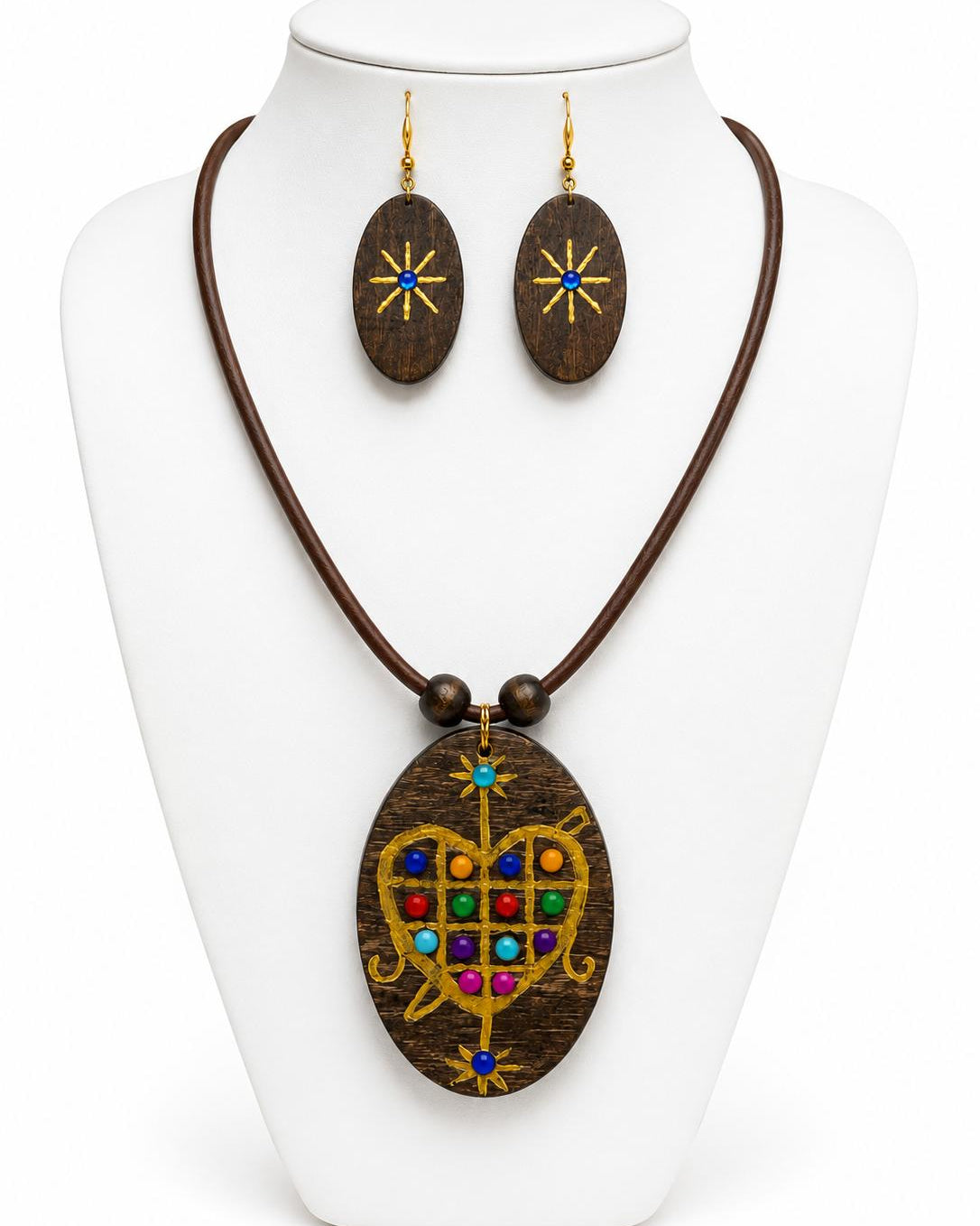 Jewelry set with wooden pendant and matching earrings on a white stand.
