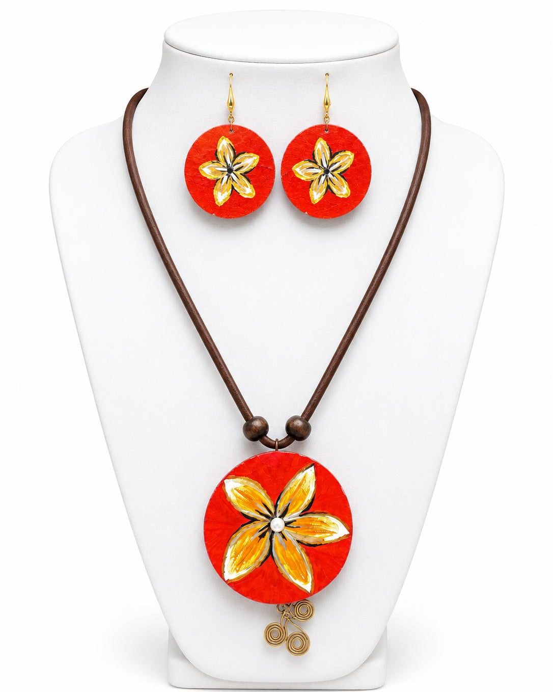 Jewelry set with red floral pendant and earrings on a white stand