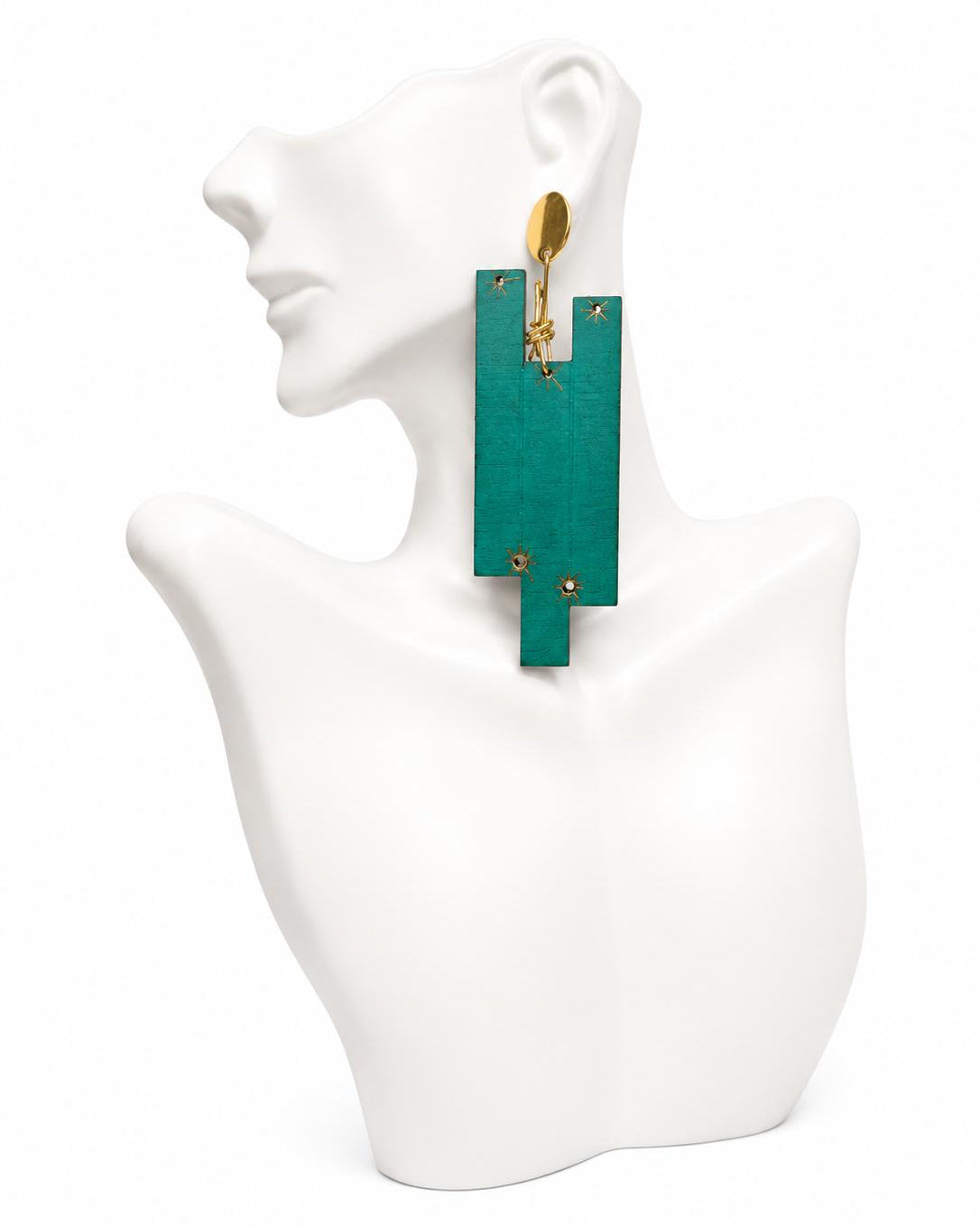 Teal earrings on a white mannequin bust
